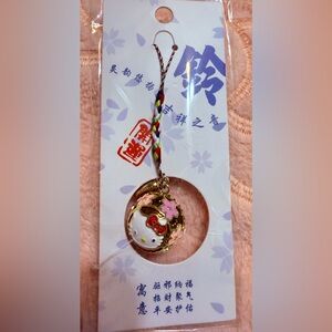 New Hello Kitty Gold Round Bell Charm features delightful sakura design 💖